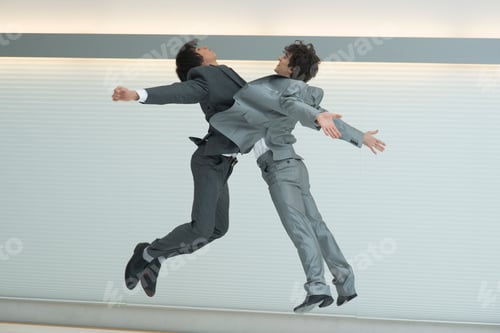 Preview: Two Businessmen Jumping In The Air, Bodies Clashing