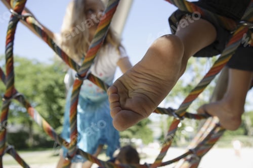Preview: Low Angle View Of Children Climbing On Rope Ladder At Playground