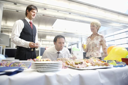 Preview: Businessman Blowing Out Candles On Birthday Cake