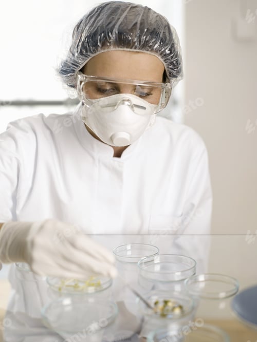 Preview: Scientist Examining Substance In Petri Dish