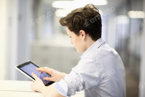 Preview: Teenage Boy Using Digital Tablet