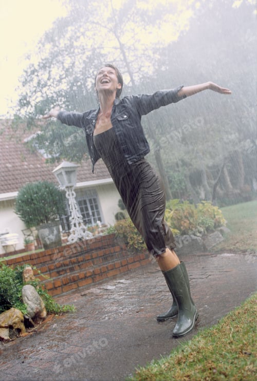 Preview: Woman In Rubber Boots Enjoying Rain