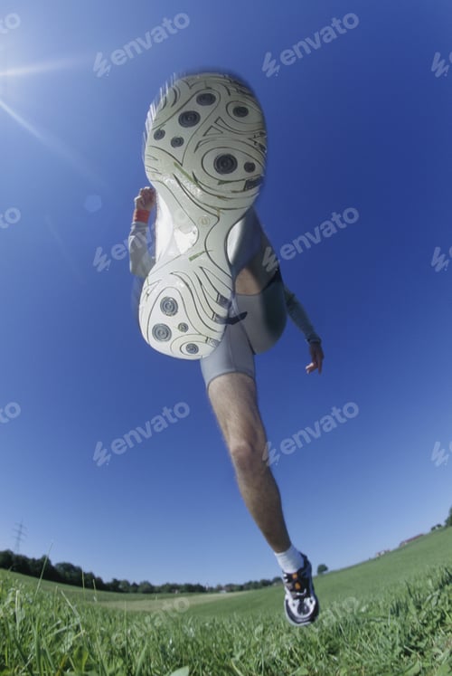 Preview: Underview, Sole Of Running Shoe, Man Running In Field