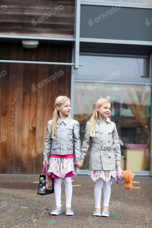 Preview: Two Young Girls Holding Hands On Street In Den Haag, The Netherlands