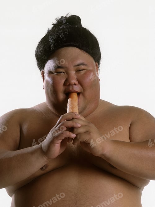 Preview: Portrait Of A Sumo Wrestler Eating A Carrot