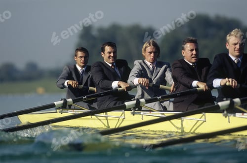 Preview: Team Of Rowers In Business Suits