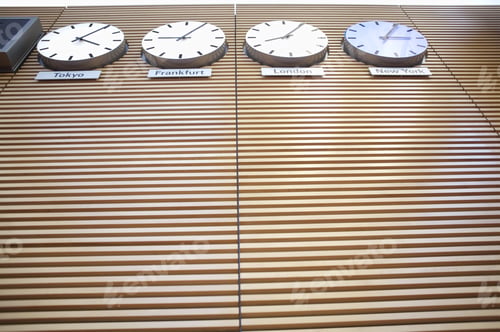 Preview: Low Angle View Of World Time Zone Clocks On Wall