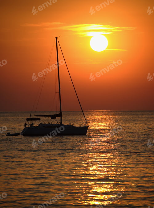 Preview: Boat At Sea While Sun Sets