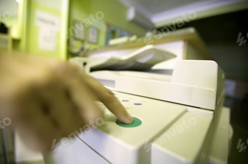 Preview: Detail View Of Hand Pushing Button On A Copy Machine