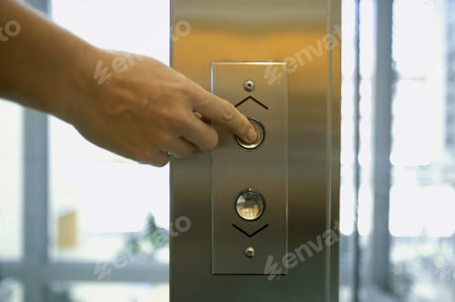 Preview: Detail View Of Hand Pushing Elevator Button