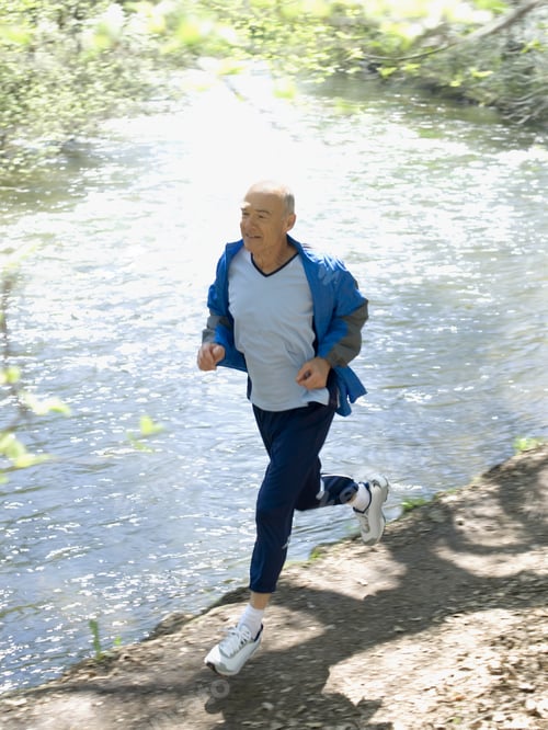 Preview: Senior Man Running On Nature Trail