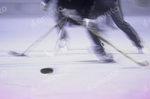 Preview: Blurred View Of Two Businessmen Racing For The Puck In An Ice Hockey Game