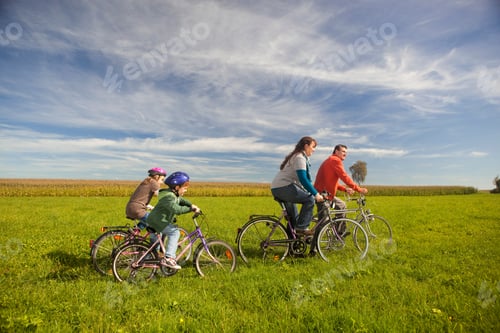Preview: Family Riding Bicycles In Schwabmuehlhausen, Bavaria, Germany