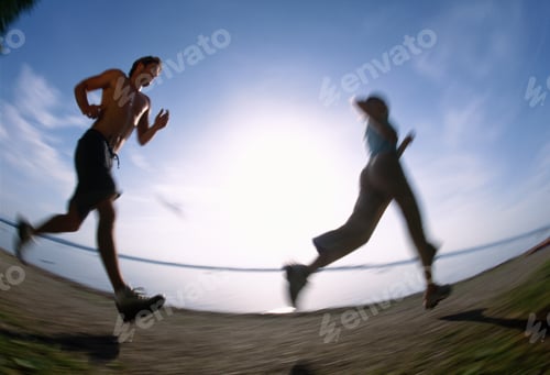 Preview: Underview Of Man And Woman Running On Beach