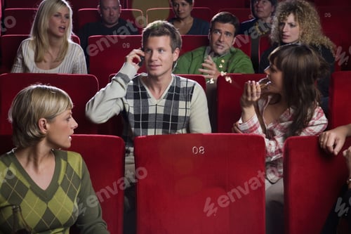 Preview: Man Talking On Cell Phone In Movie Theater