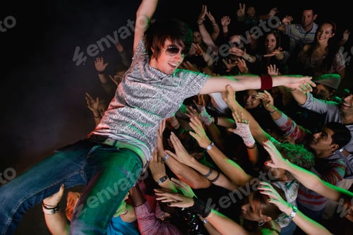 Preview: Performer Body Surfing Across Audience At Concert