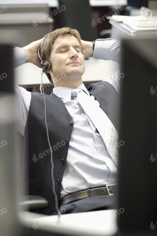 Preview: Businessman Leaning Back In Chair With Eyes Closed