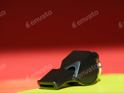 Preview: Close Up Of A Whistle On Red And Yellow Cards