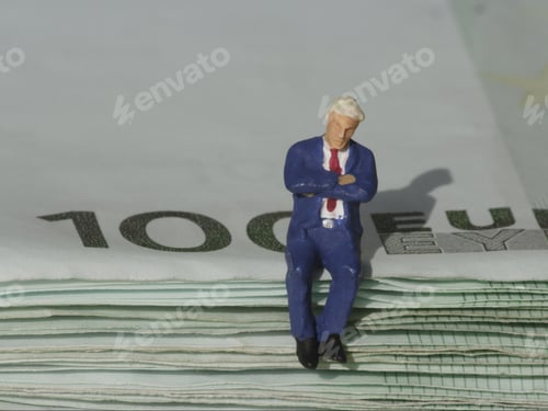 Preview: Figurine Of Businessman Sitting On Stack Of Euros