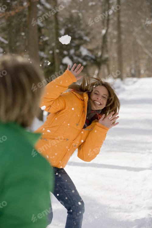 Preview: Man Throwing Snowball At Woman
