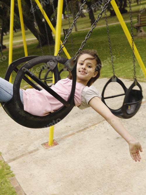 Preview: Girl On Tire Swing At Park