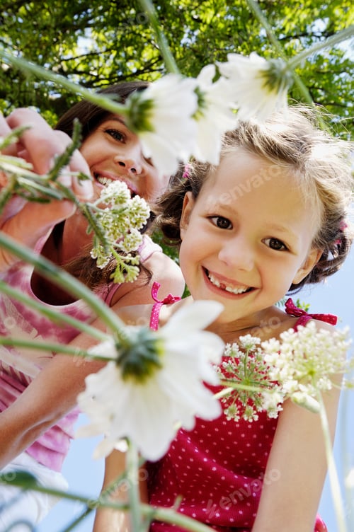 Preview: Mother And Daughter Smelling Flowers
