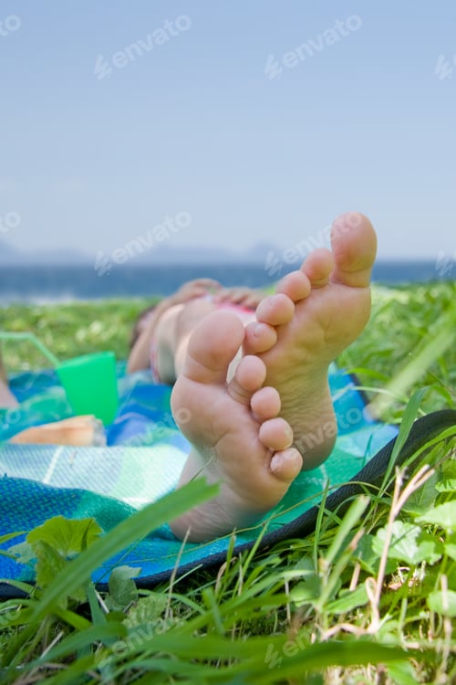 Preview: A Person Sunbathing, Close-Up Of Feet