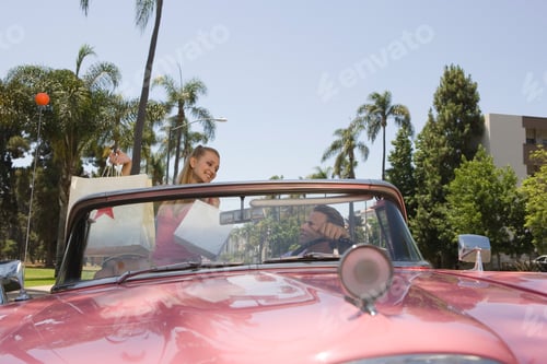 Preview: Couple In Old Fashioned Convertible Car