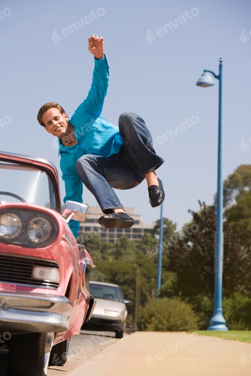 Preview: Man Jumping Into Old Fashioned Convertible Car
