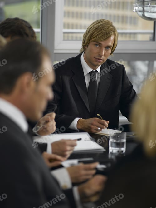 Preview: Businesspeople Having Meeting At Conference Table