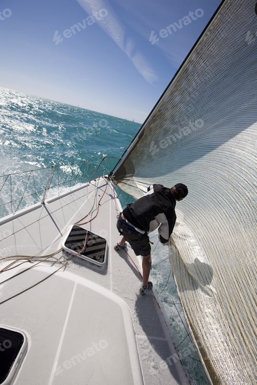 Preview: Mid Adult Man Standing On Sailboat Holding Rope In Key West, Florida, Usa