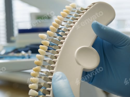 Preview: Dentist Holding Assortment Of Teeth
