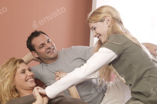 Preview: View Of A Married Couple Playing With Their Daughter