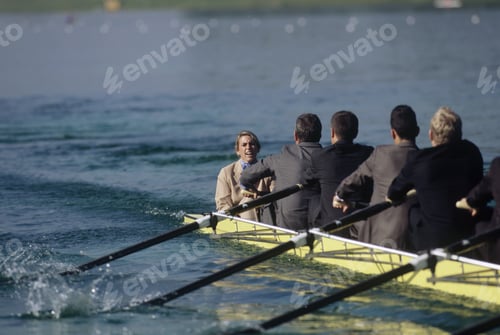 Preview: Team Of Rowers In Business Suits