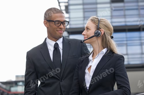 Preview: Young Businesspeople With Headset Outdoors
