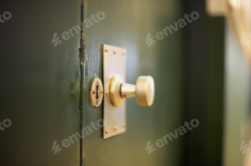 Preview: Detail View Of A Gold Doorknob On A Black Door
