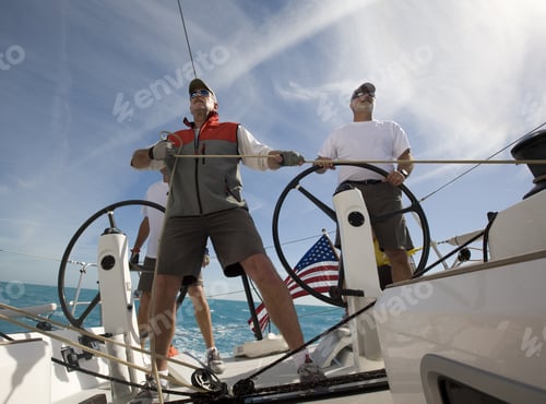 Preview: Low Angle View Of Mature Men Sailing Boat In Key West, Florida, Usa