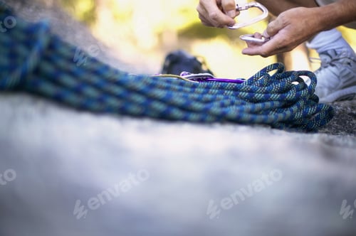Preview: Detail View Of Rock Climbing Rope With Man In Background