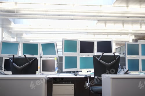 Preview: Empty Computer Workstations With Many Monitors
