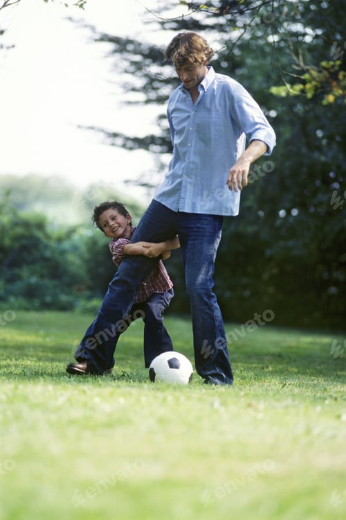 Preview: Father And Son Playing Soccer