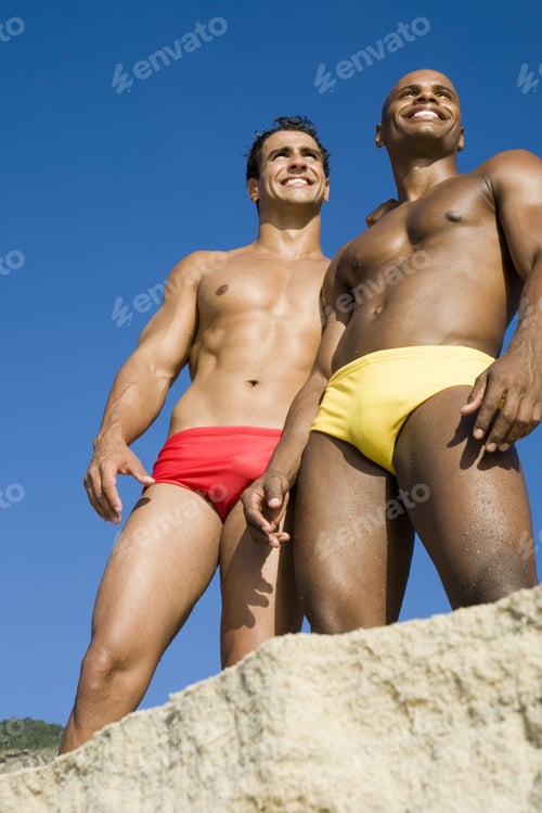 Preview: Low Angle View Of Multi-Ethnic Men At Beach