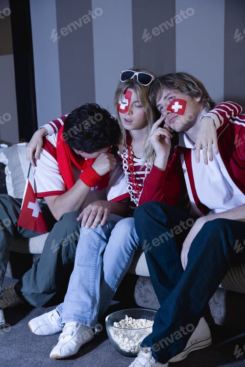 Preview: Disappointed Friends With Swiss Flags Painted On Faces