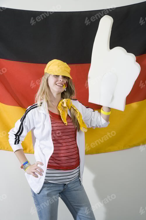 Preview: Female Sports Fan Standing In Front Of German Flag