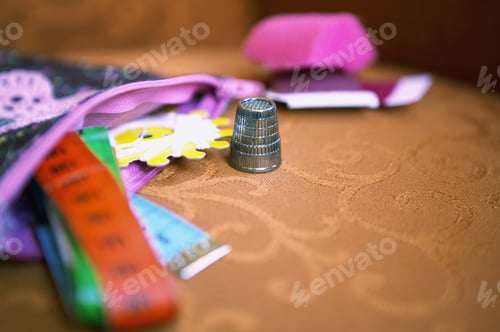 Preview: Detail View Of Measuring Tapes And Sewing Equipment