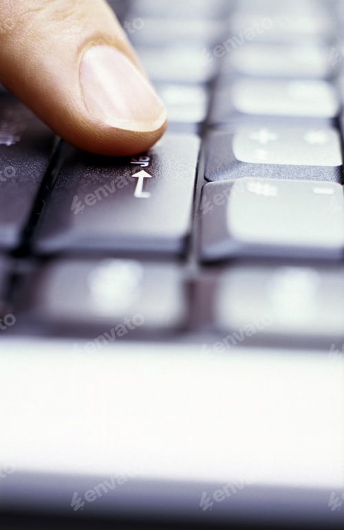 Preview: Finger Pressing The Arrow Key On Computer Keyboard