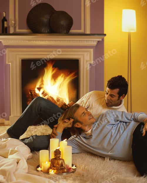 Preview: Couple Relaxing by Fireplace with Candles and Buddha