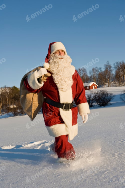 Preview: Santa Claus Carrying A Sack Full Of Presents Through The Snow