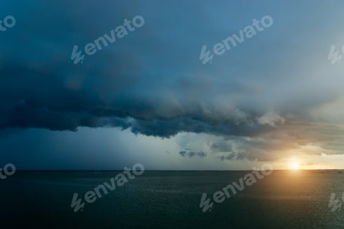Preview: Dark Cloud Rain Are Falling In The Sea With Sunset.