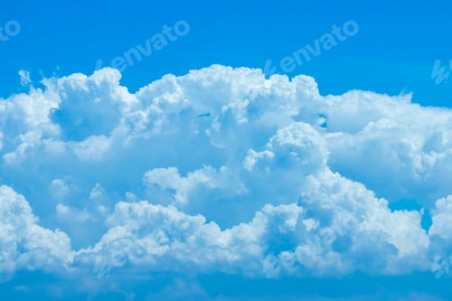 Fluffy White Clouds Against a Clear Blue Sky