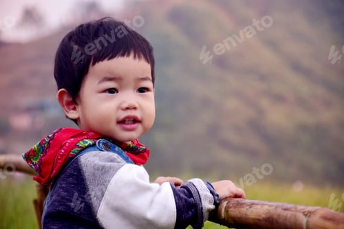 Preview: A Little Boy Sianding On Field With Nature